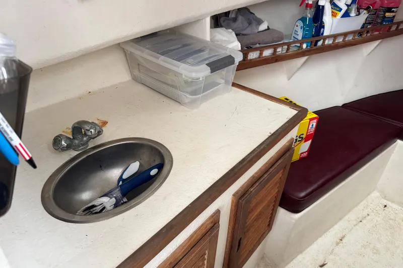 Slide: The Image of Interior of a 2001 Eastern Lobsterman 27 boat with sink and storage. - 8