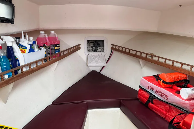 Slide: The Image of Interior of a 2001 Eastern Lobsterman 27 boat with cleaning supplies and life jackets. - 9