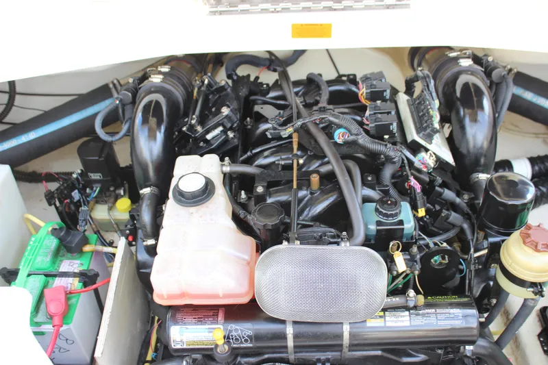 Slide: The Image of Engine compartment of a 2005 Chaparral 265 SSi boat, showcasing detailed components. - 16