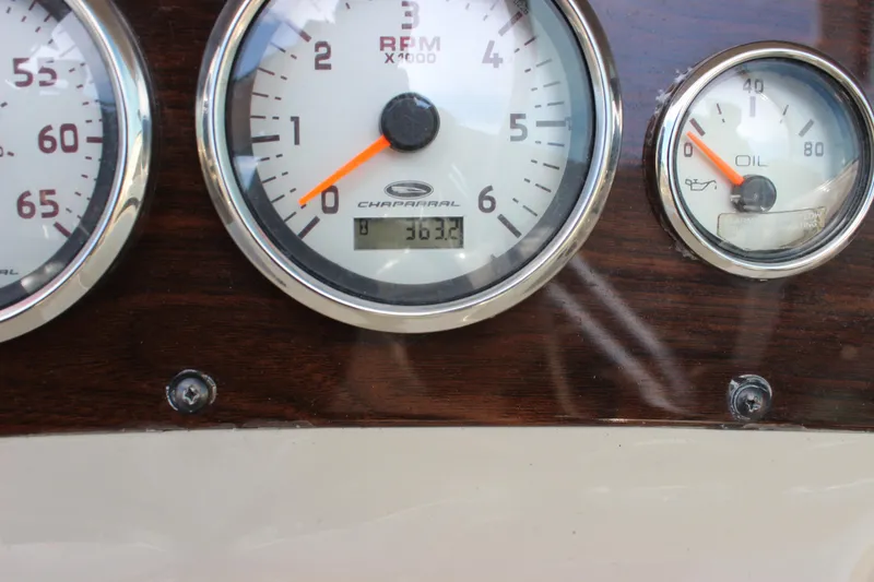 Slide: The Image of Dashboard gauges of a 2005 Chaparral 265 SSi boat, displaying RPM and oil pressure. - 20
