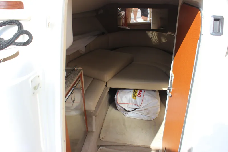 Slide: The Image of Interior cabin of 2005 Chaparral 265 SSi boat with seating and storage. - 22