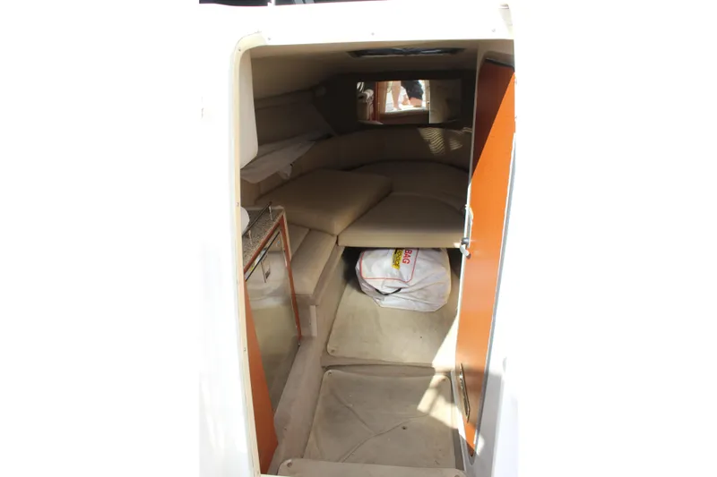Slide: The Image of 2005 Chaparral 265 SSi cabin interior with seating and storage space. - 23
