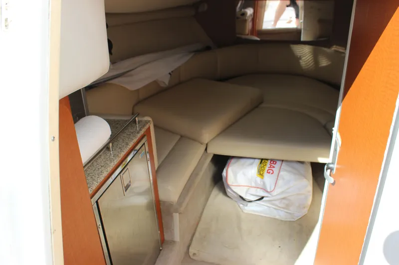 Slide: The Image of Interior cabin of 2005 Chaparral 265 SSi boat with seating and kitchenette. - 24