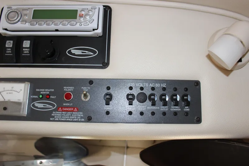 Slide: The Image of Control panel of a 2005 Chaparral 265 SSi boat with switches and gauges. - 26