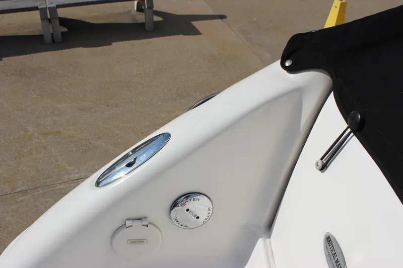 Slide: The Image of 2005 Chaparral 265 SSi boat detail with black cover and deck fittings. - 27