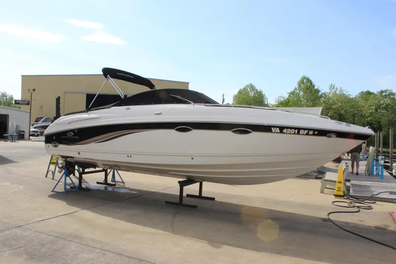 Slide: The Image of 2005 Chaparral 265 SSi boat on stands in a marina setting. - 7
