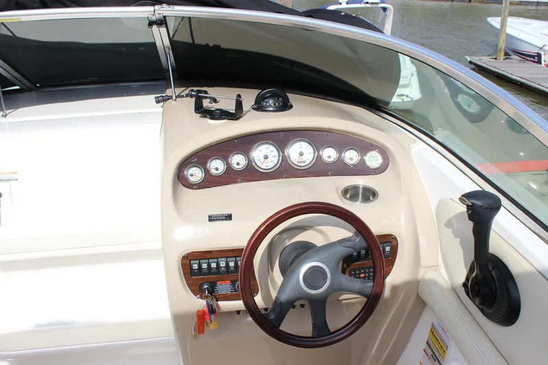 Slide: The Image of 2005 Chaparral 265 SSi boat dashboard with steering wheel and instrument panel. - 9