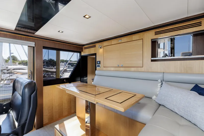 Slide: The Image of Luxurious interior of 2023 North Pacific 49 Euro yacht with elegant seating and wooden accents. - 14