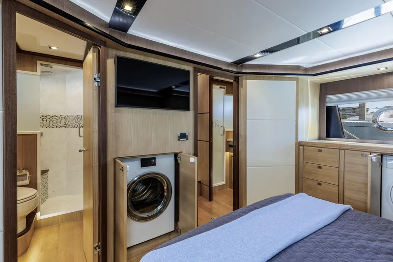 Slide: The Image of Luxurious 2023 North Pacific 49 Euro yacht interior with modern amenities and elegant wood finishes. - 18