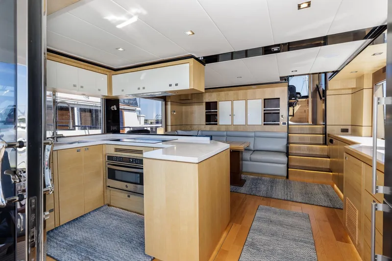 Slide: The Image of Luxurious interior of 2023 North Pacific 49 Euro yacht with modern kitchen and seating area. - 2