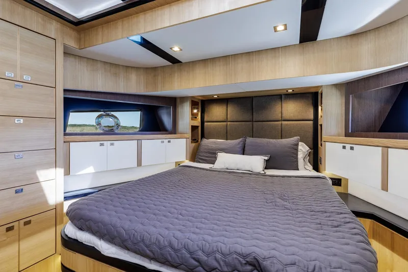 Slide: The Image of Luxurious bedroom interior of 2023 North Pacific 49 Euro yacht, featuring modern design and cozy bedding. - 20