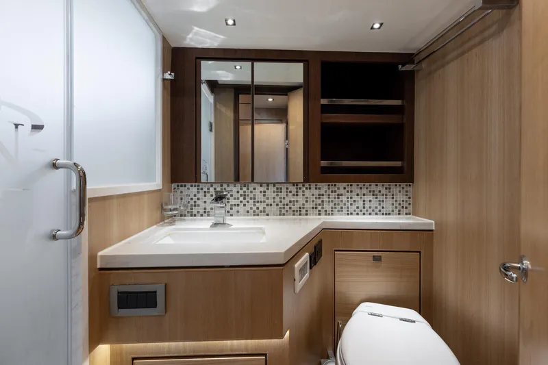Slide: The Image of Luxurious bathroom in 2023 North Pacific 49 Euro yacht, featuring modern fixtures and elegant wood finishes. - 22