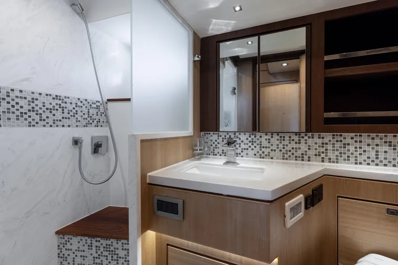 Slide: The Image of Luxurious bathroom in 2023 North Pacific 49 Euro yacht, featuring modern fixtures and elegant tile design. - 23