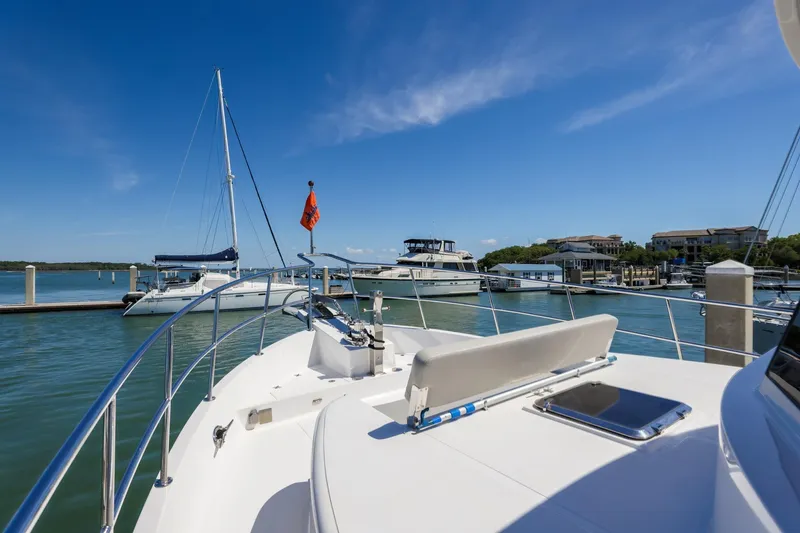 Slide: The Image of 2023 North Pacific 49 Euro yacht docked at a marina under clear blue skies. - 28