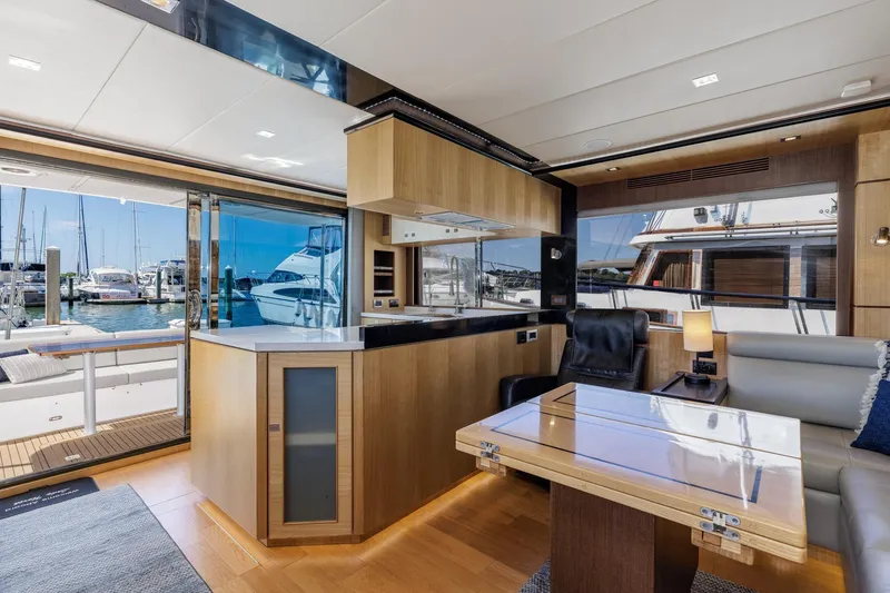 Slide: The Image of Luxurious interior of 2023 North Pacific 49 Euro yacht with modern design and marina view. - 3