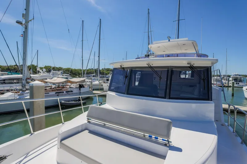 Slide: The Image of 2023 North Pacific 49 Euro yacht docked in a marina under clear blue skies. - 30