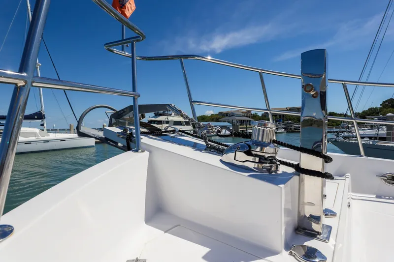Slide: The Image of 2023 North Pacific 49 Euro yacht deck with chrome railing and marina view. - 32