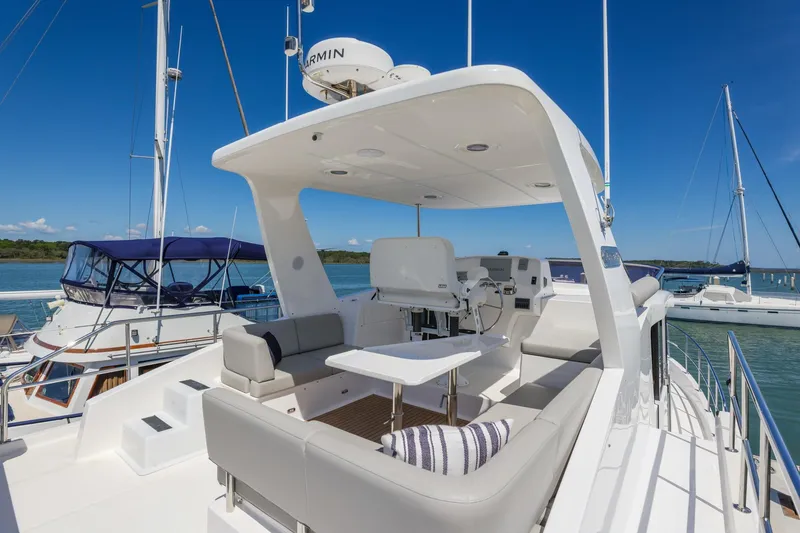 Slide: The Image of 2023 North Pacific 49 Euro yacht with spacious deck and seating area. - 34
