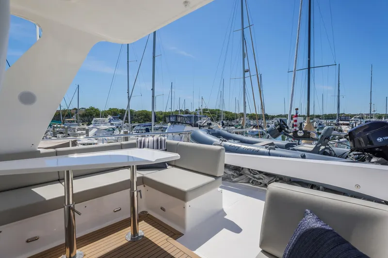 Slide: The Image of Luxurious 2023 North Pacific 49 Euro yacht deck with seating, docked in a marina. - 35