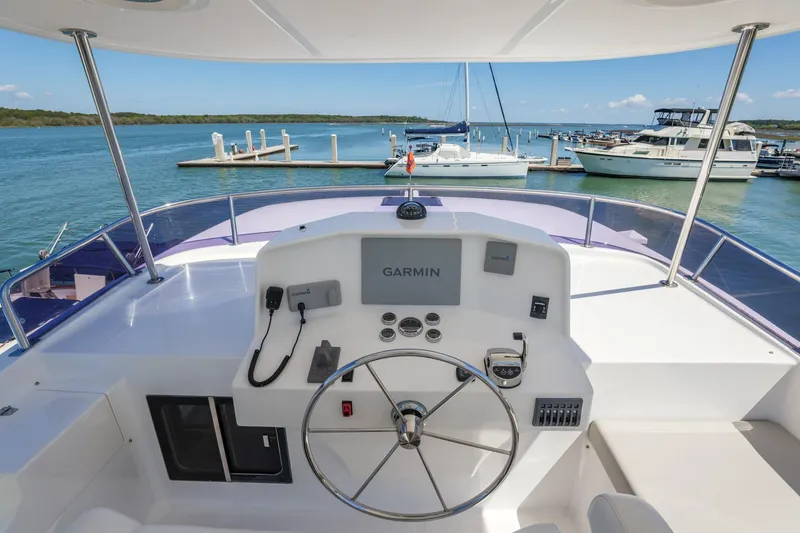 Slide: The Image of Flybridge helm of 2023 North Pacific 49 Euro yacht with Garmin navigation system. - 37