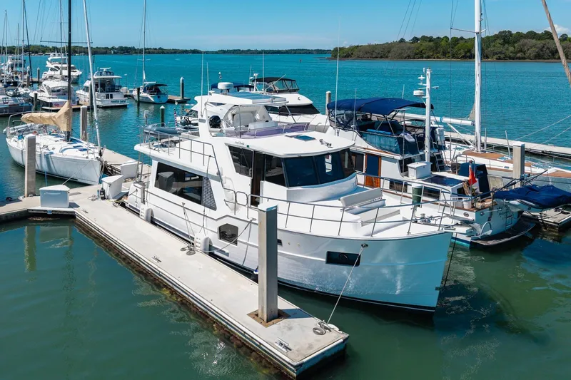 Slide: The Image of 2023 North Pacific 49 Euro yacht docked at marina, surrounded by other boats. - 45