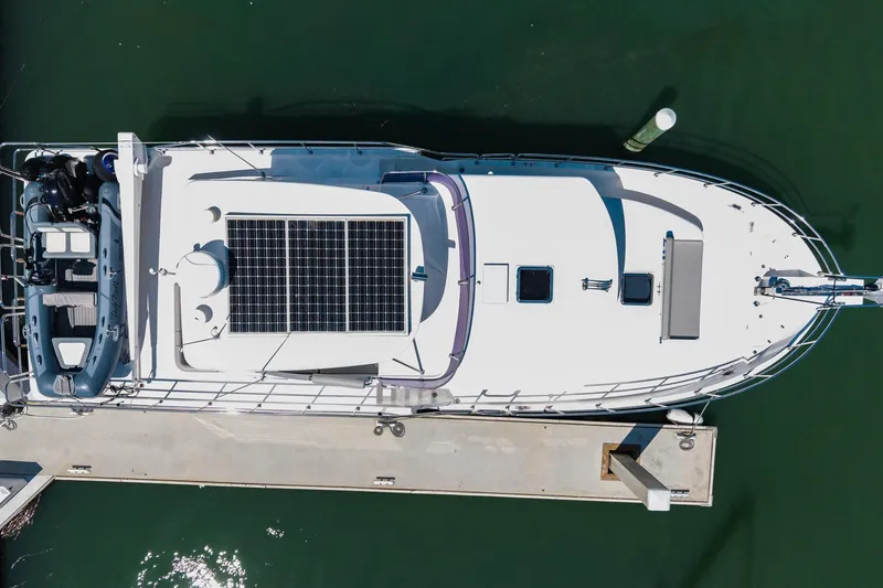 Slide: The Image of Aerial view of 2023 North Pacific 49 Euro yacht with solar panels docked. - 48