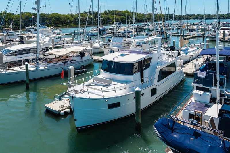 Slide: The Image of 2023 North Pacific 49 Euro yacht docked in a busy marina. - 49