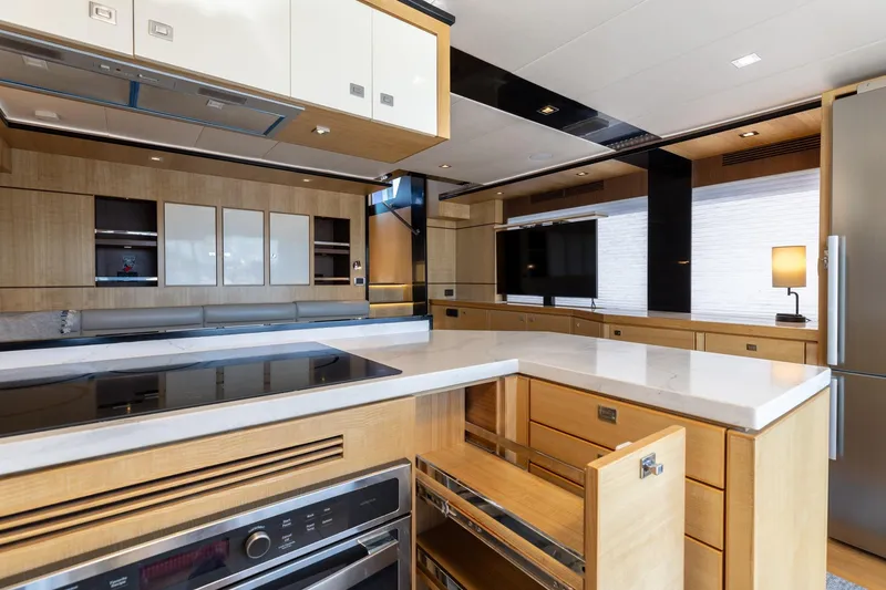 Slide: The Image of Luxurious kitchen interior of 2023 North Pacific 49 Euro yacht, featuring modern appliances and sleek design. - 5