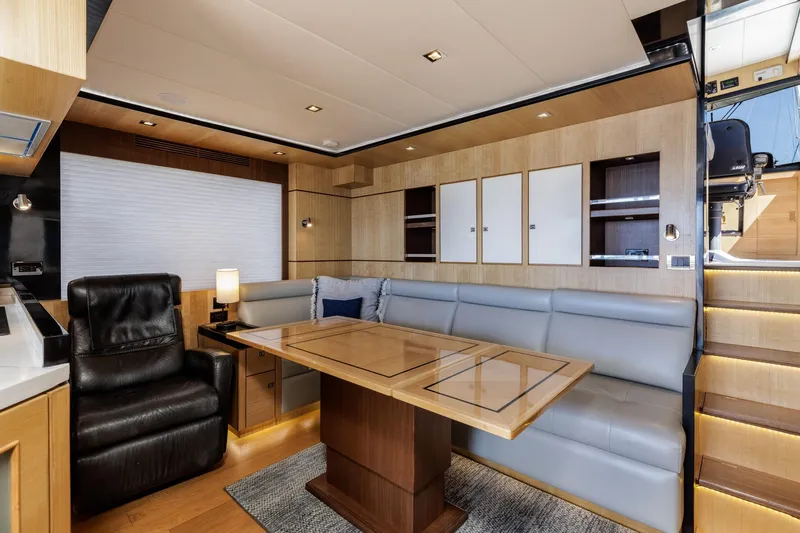 Slide: The Image of Luxurious interior of 2023 North Pacific 49 Euro yacht with modern seating and wooden accents. - 6