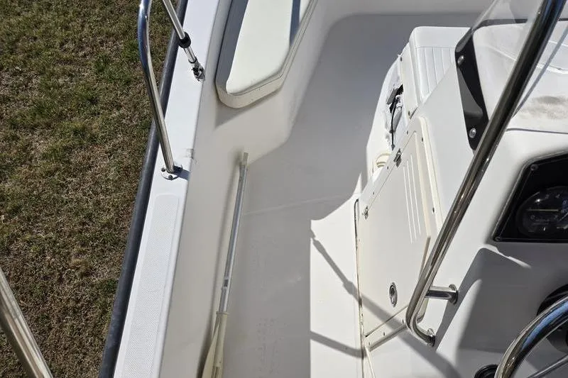 Slide: The Image of 2007 Boston Whaler 190 Montauk boat interior with seating and railing details. - 11