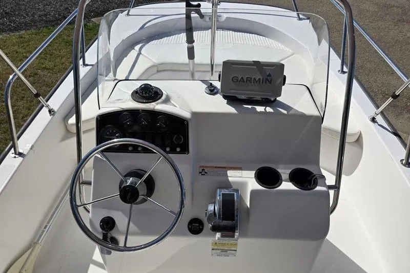 Slide: The Image of 2007 Boston Whaler 190 Montauk boat console with Garmin GPS and steering wheel. - 12