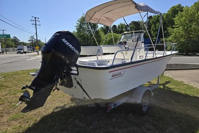 Slide: The Image of 2007 Boston Whaler 190 Montauk boat with Mercury engine on trailer. - 15