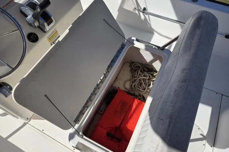 Slide: The Image of 2007 Boston Whaler 190 Montauk boat storage with ropes and safety gear. - 17