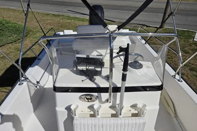 Slide: The Image of 2007 Boston Whaler 190 Montauk boat interior with steering console and equipment. - 4