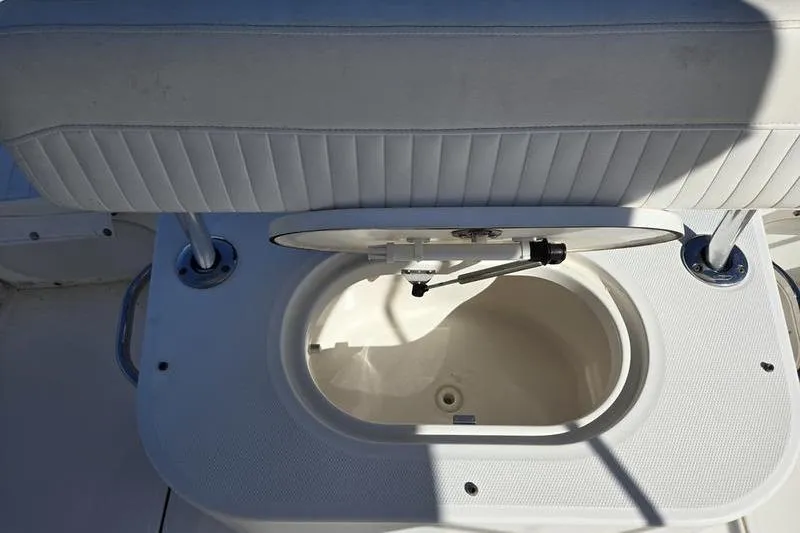 Slide: The Image of Boston Whaler 190 Montauk 2007 boat seat with open storage compartment. - 5