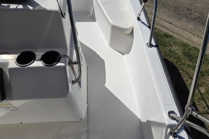 Slide: The Image of 2007 Boston Whaler 190 Montauk boat interior with cup holders and seating area. - 6