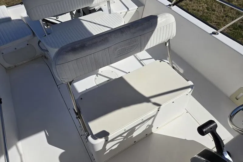 Slide: The Image of 2007 Boston Whaler 190 Montauk boat interior with seating and control area. - 7