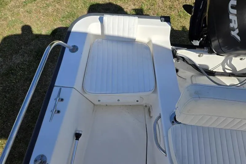 Slide: The Image of 2007 Boston Whaler 190 Montauk boat interior with seating and Mercury engine. - 8