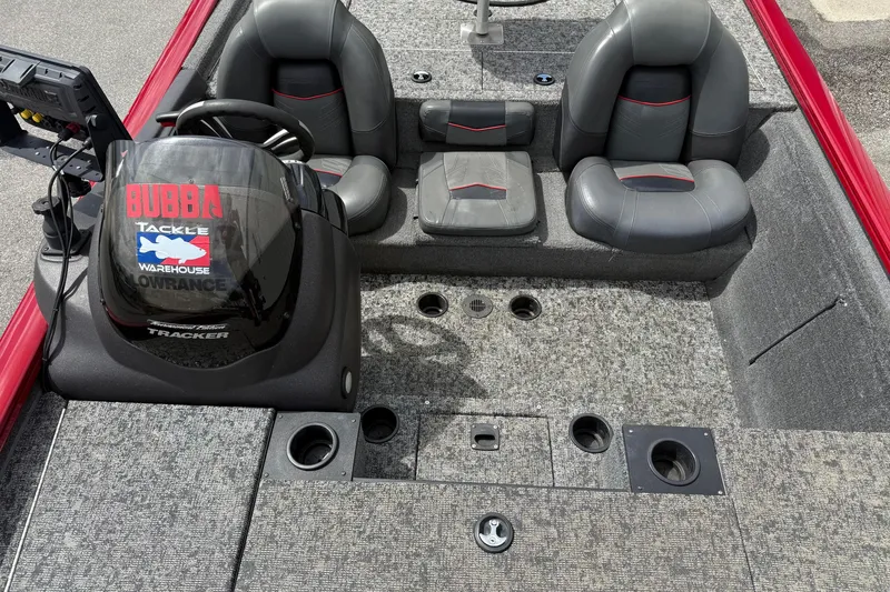 Slide: The Image of Interior of 2023 Pro Team 195 boat with steering console and seating. - 15