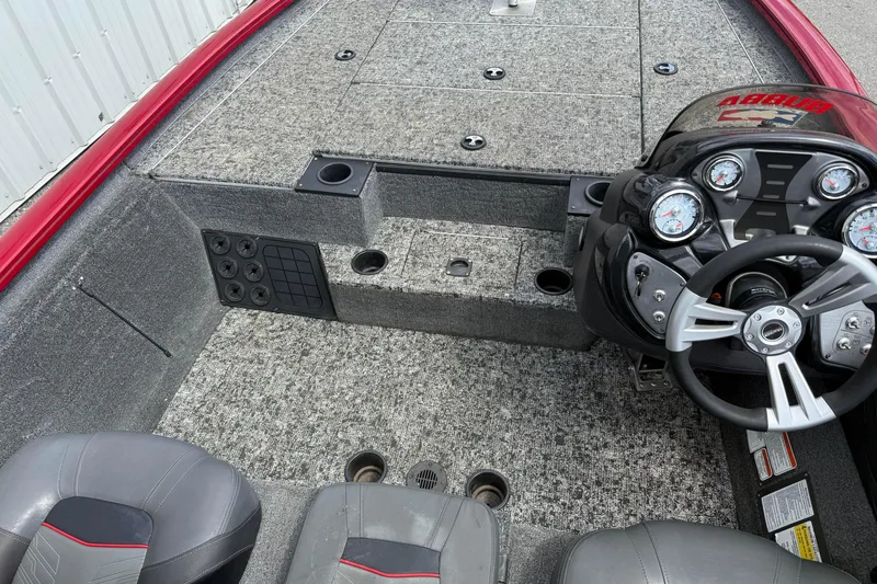 Slide: The Image of Interior view of 2023 Pro Team 195 boat with steering console and seating. - 17