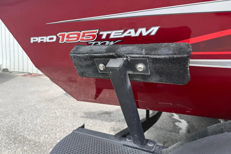 Slide: The Image of Red 2023 Pro Team 195 boat with visible branding and trailer support. - 3