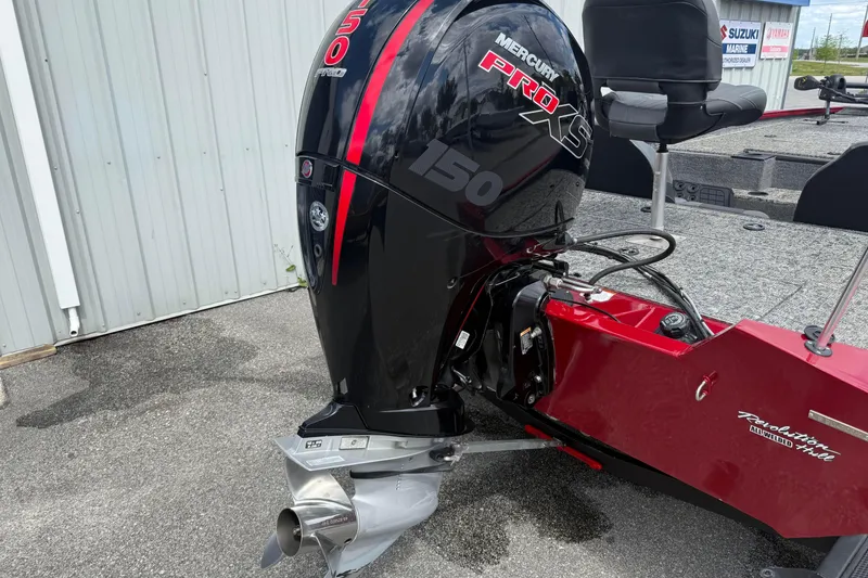 Slide: The Image of 2023 Pro Team 195 boat with Mercury Pro XS 150 engine, red and black design. - 4