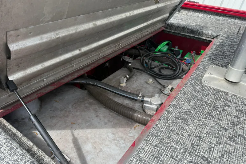 Slide: The Image of Open storage compartment of 2023 Pro Team 195 boat, showing cables and equipment. - 5