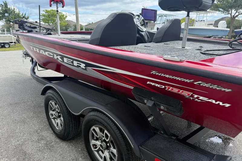 Slide: The Image of Red 2023 Tracker Pro Team 195 Tournament Edition boat on trailer. - 8