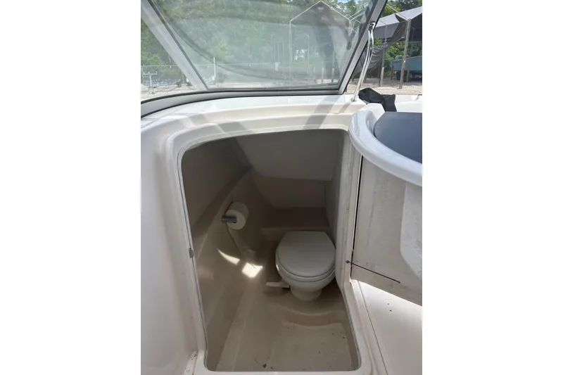 Slide: The Image of 2008 Regal 2700 Bowrider boat interior with compact marine toilet. - 11