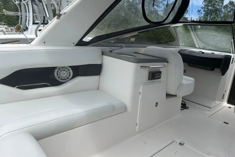 Slide: The Image of 2008 Regal 2700 Bowrider interior with white seating and modern dashboard. - 17