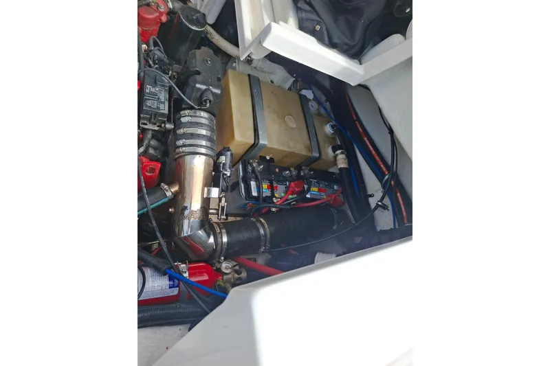 Slide: The Image of Engine compartment of a 2008 Regal 2700 Bowrider boat, showing mechanical components. - 22