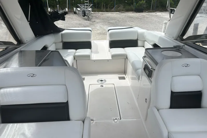 Slide: The Image of 2008 Regal 2700 Bowrider interior with white seating and sleek design. - 4
