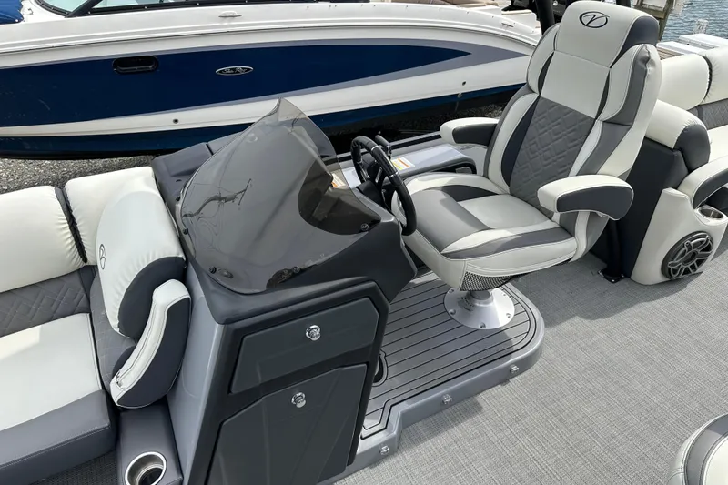 Slide: The Image of 2024 Veranda VP Tower 25 RCT boat interior with luxurious seating and modern helm design. - 21