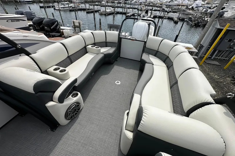 Slide: The Image of Luxurious 2024 Veranda VP Tower 25 RCT pontoon boat with spacious seating at marina. - 22